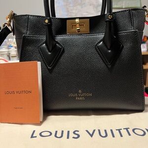 Louis Vuitton Black Satchel with Gold Accents